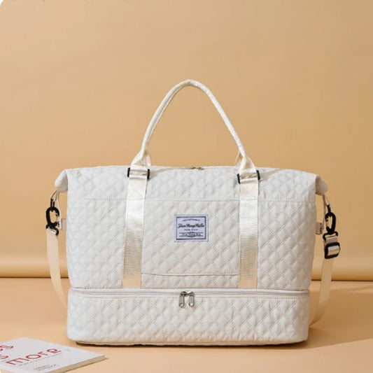 Quilted travel tote bag with shoe compartment