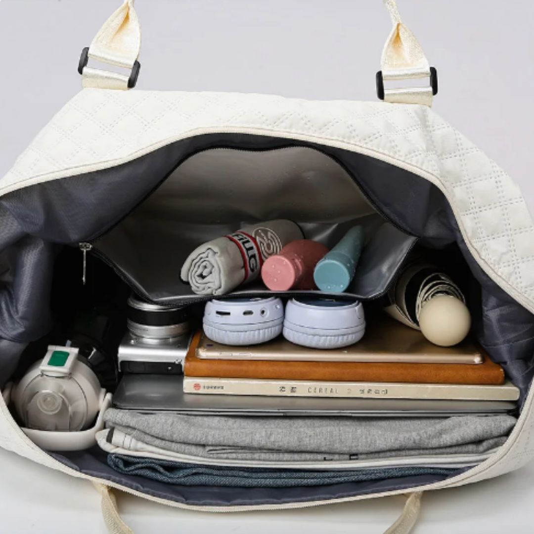 Quilted travel tote bag with shoe compartment